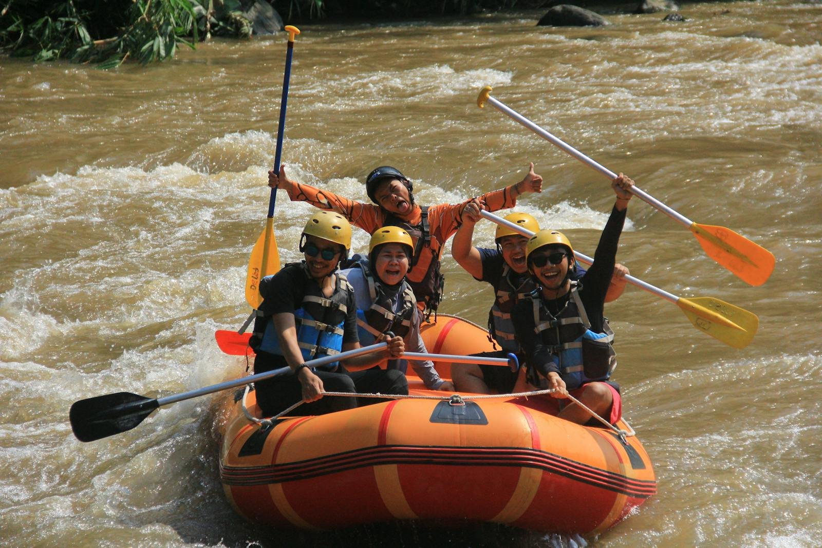 A group of people are rafting down a river